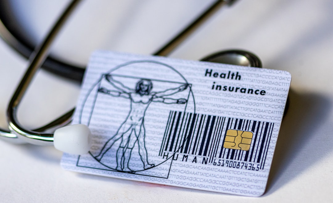 Man in hospital bed reviewing supplemental health insurance paperwork with family